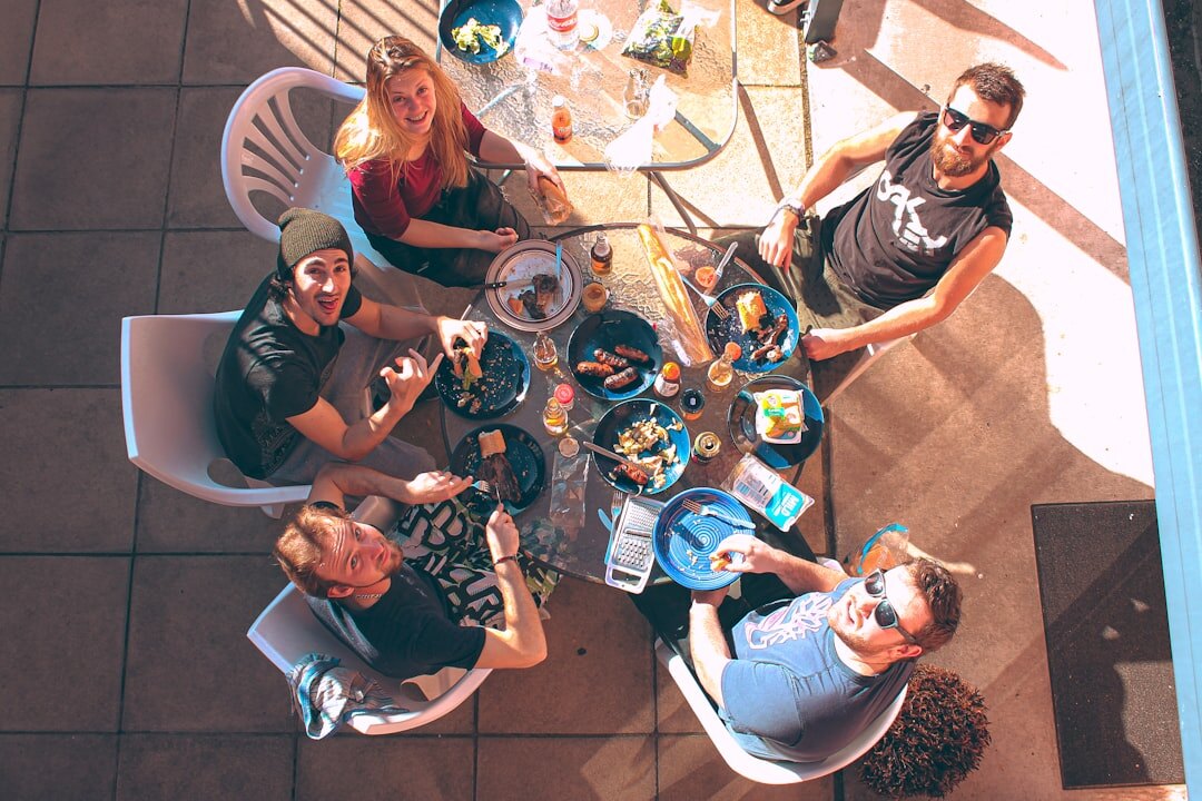 Diverse team of professionals discussing around a table in a bright office in Brussels